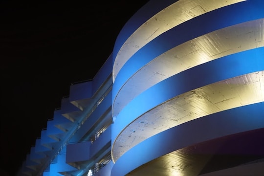 High-tech architectural blueprint with gold and deep blue accents on a textured background.