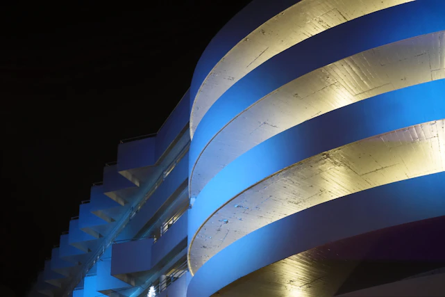 Sophisticated architectural blueprint with golden technical lines on deep blue background.