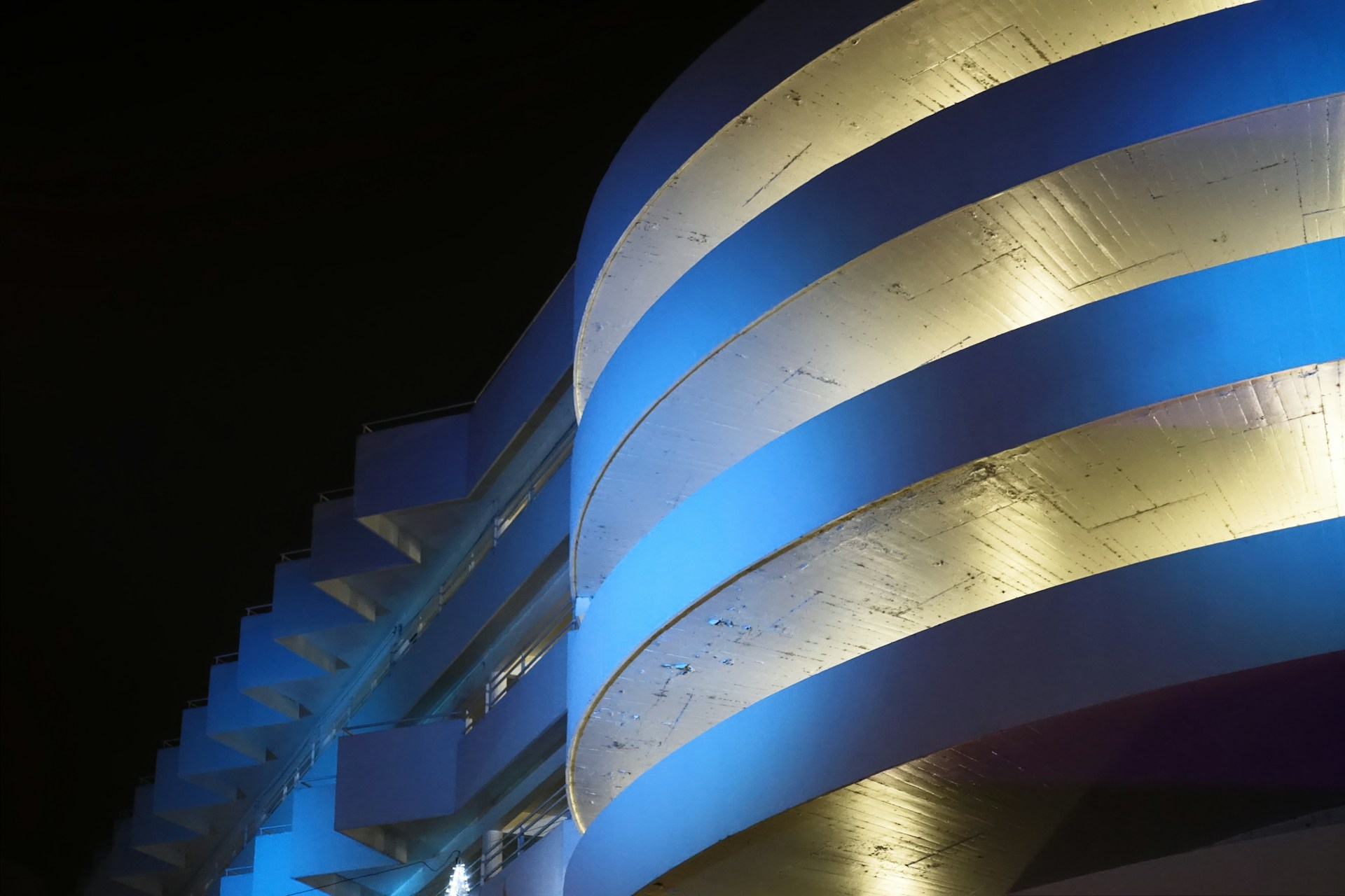 woman wearing yellow long-sleeved dress under white clouds and blue sky during daytime
