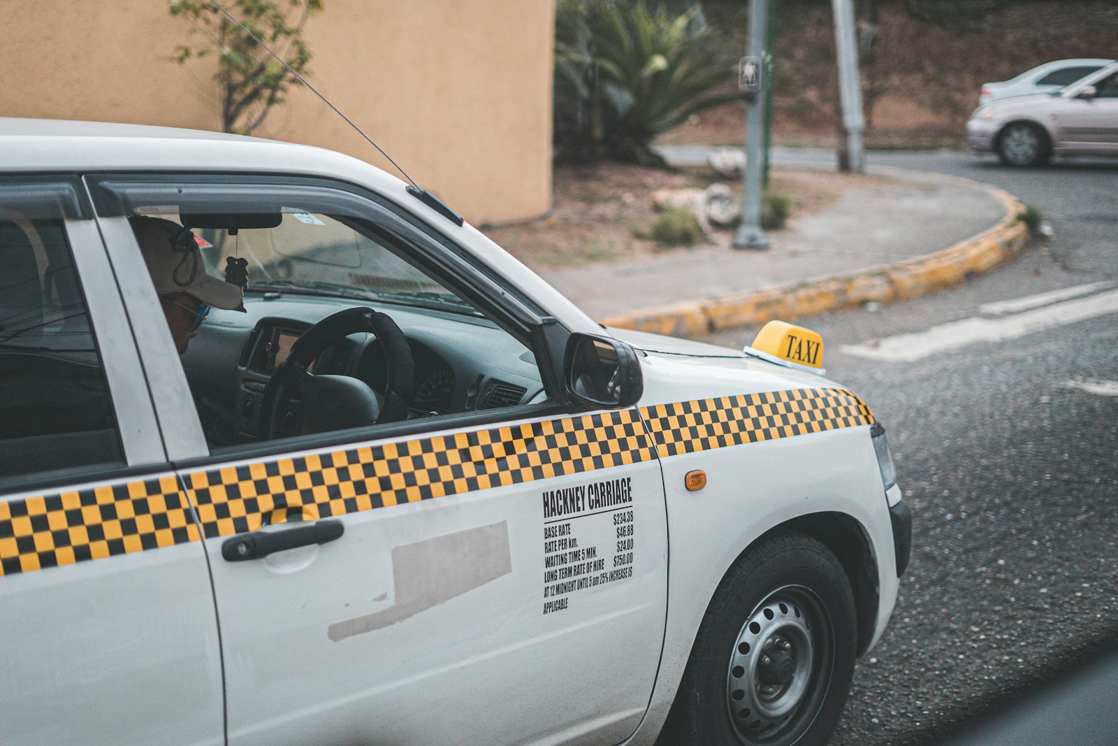 Sony a7S II + Sony FE 50mm F1.8 sample photo. Parked taxi on road photography