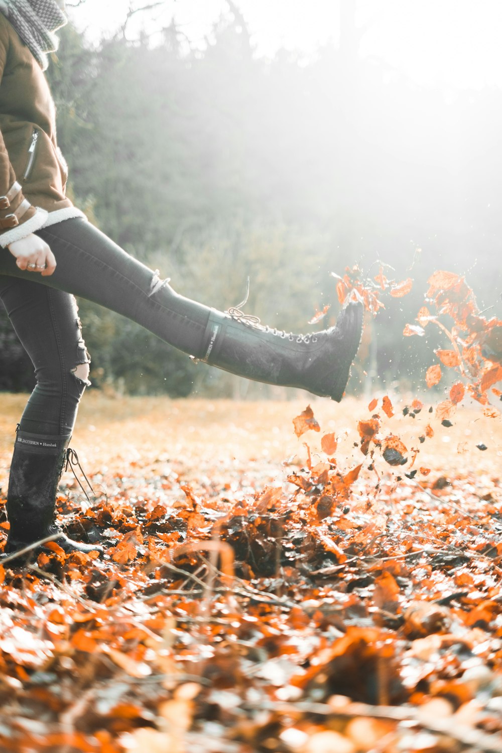 person standing on brown grass