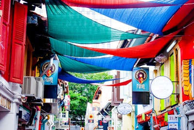 A vibrant street scene in Tamil Nadu with colorful local shop signs in Tamil script.