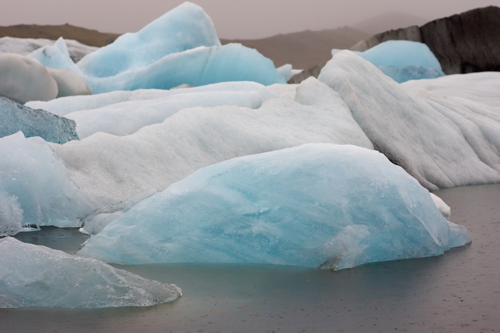 blue and white ice on water