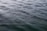 Rippling water surface with gentle waves creating a textured pattern across the expanse.