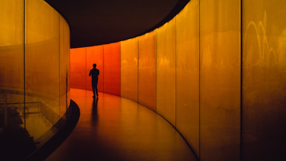 man walking in the building pathway