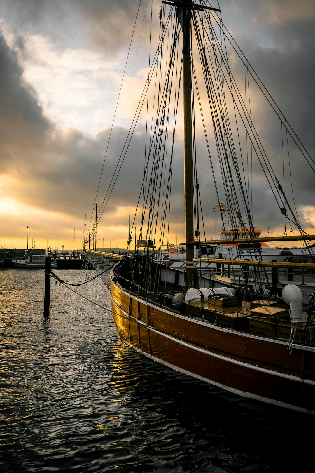 brown wooden boat on the body of water