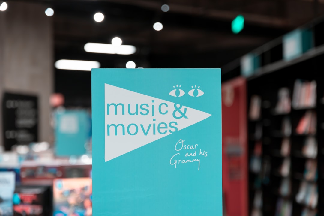 selective focus photography of Music & Movies card