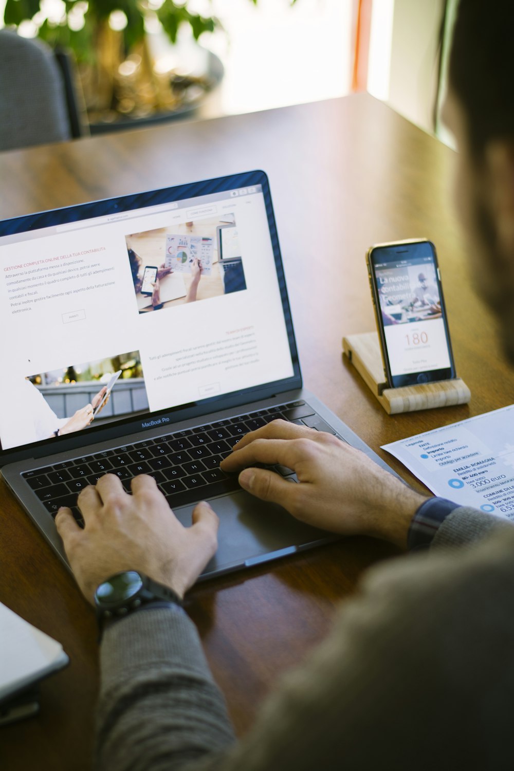 selective focus photography of person using black laptop computer