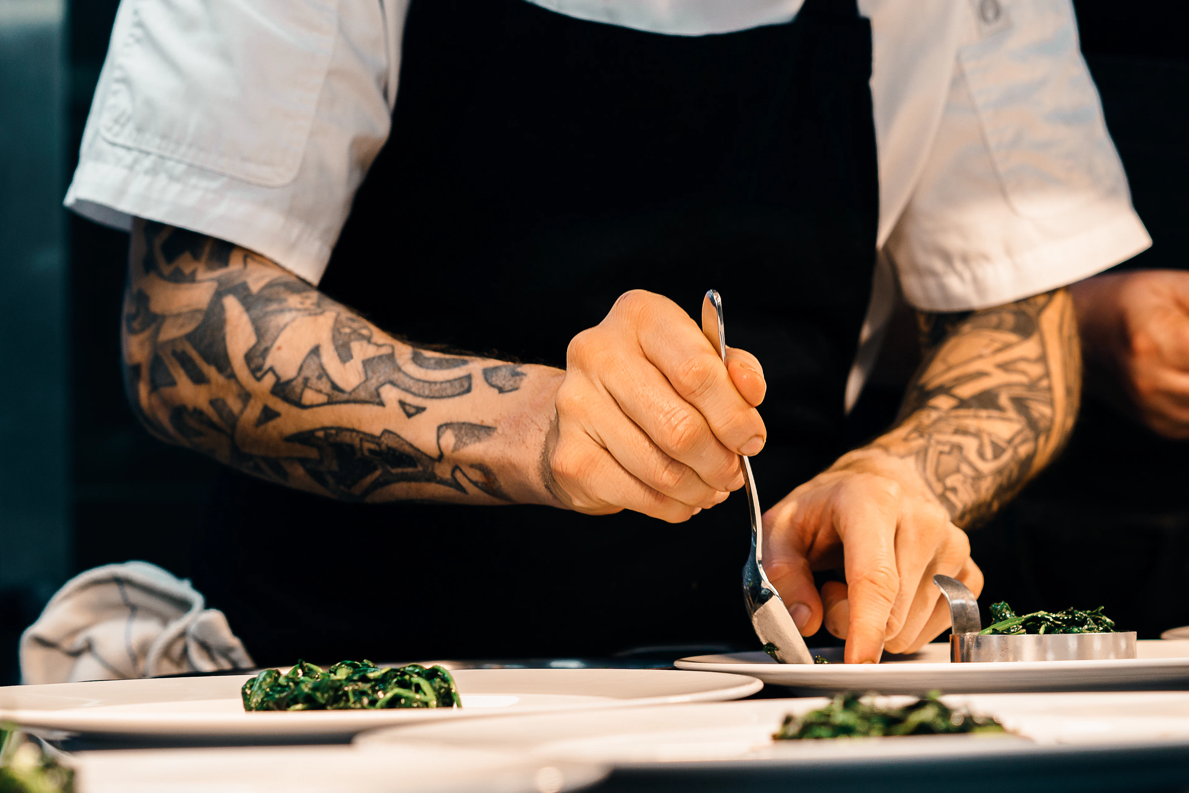 Urban Entertaining chefs plating a dish from scratch in the kitchen