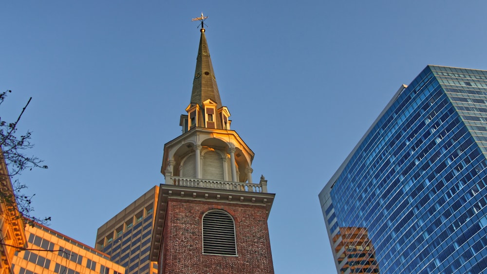 a church steeple with a cross on top of it