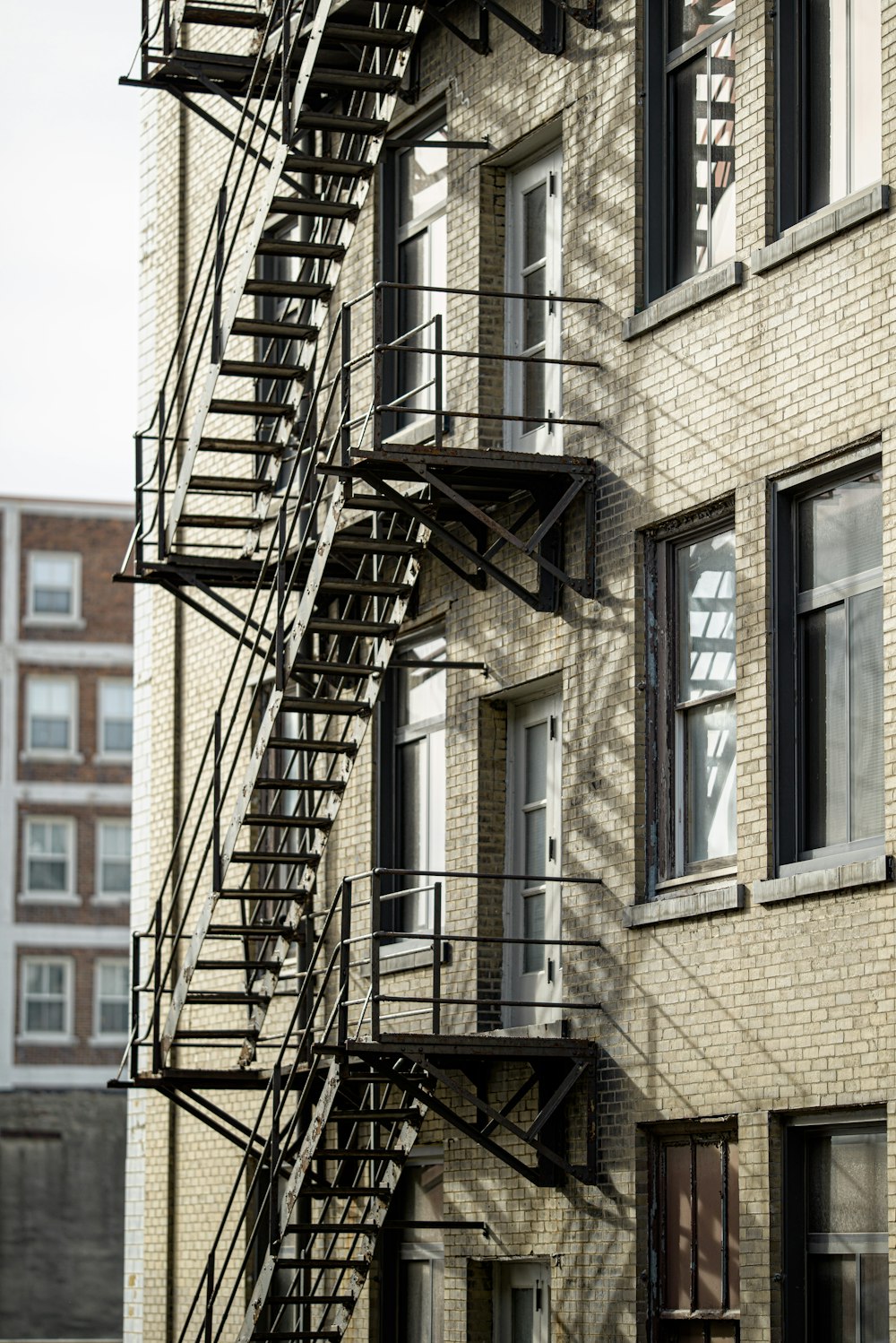 building with fire escape ladder during day