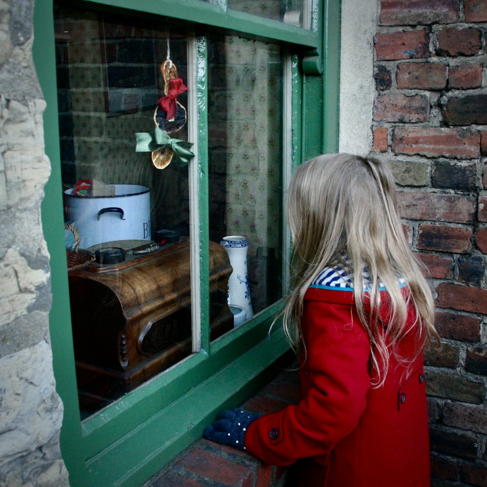 girl near glass window