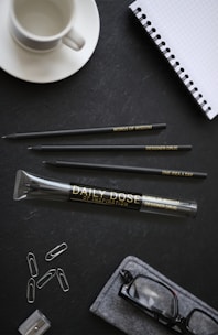 A neatly organized desk with savings jars labeled for different goals.
