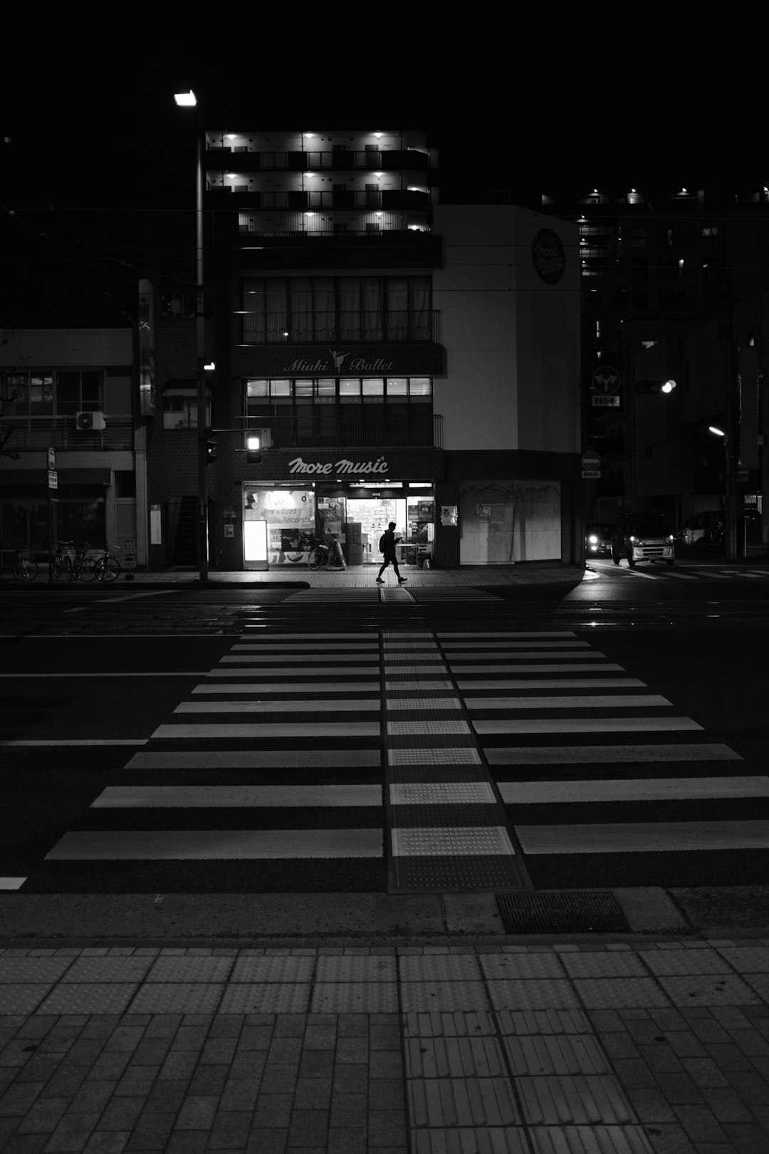 grayscale photography of pedestrian lane