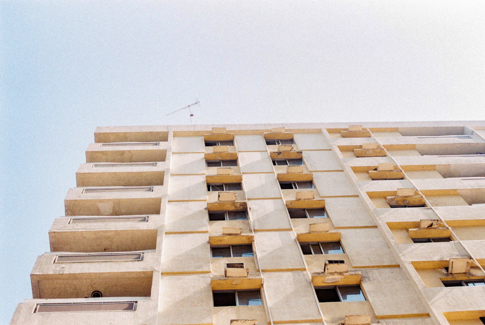 Warm stone façade with rhythmic windows