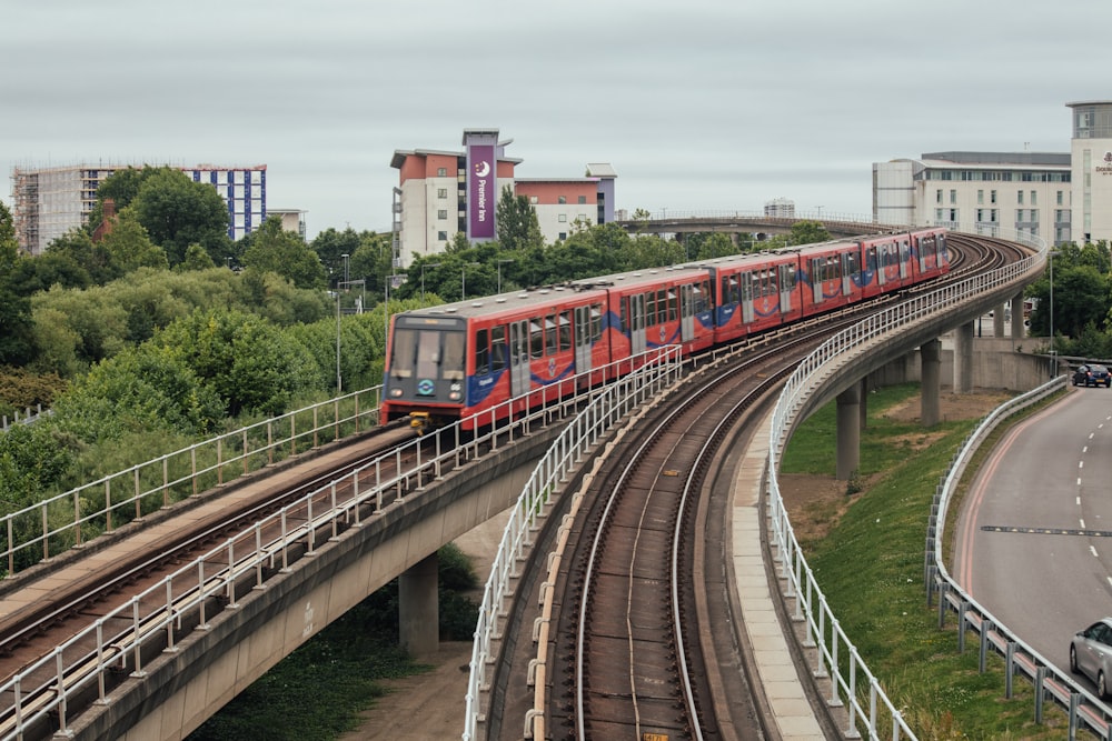 red and blue train in the city