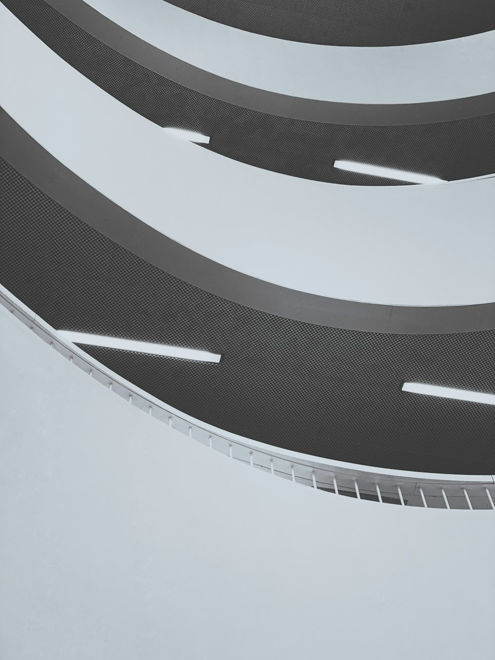 a black and white photo of a curved ceiling