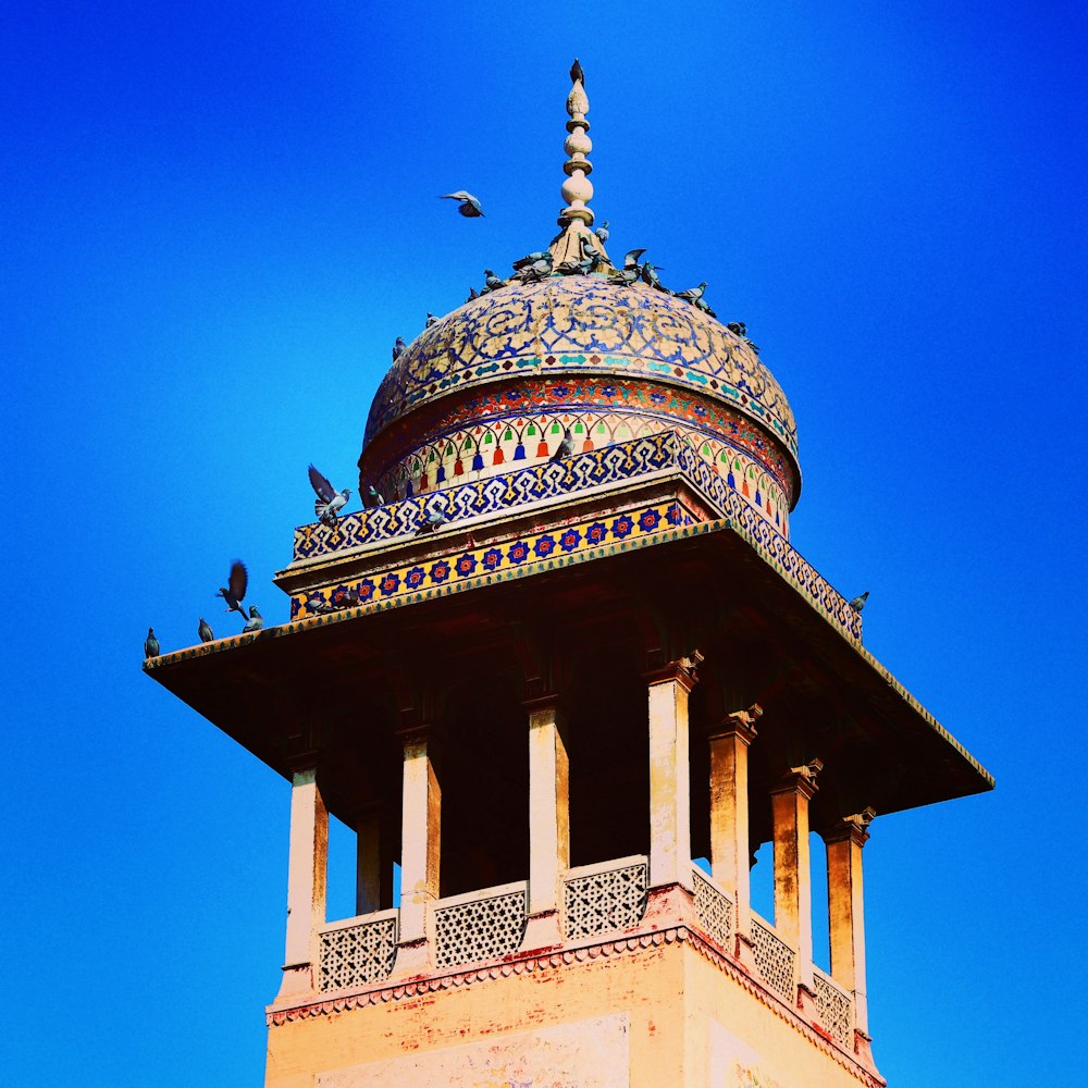 a tall tower with a blue sky in the background