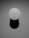 A top-down view of a Bose portable speaker, featuring its control buttons including power, volume, and Bluetooth icons. The speaker is casting a shadow, and the environment appears minimalistic with a smooth surface.