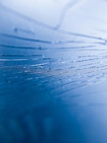 A calm blue and white abstract representation of AI neural networks.