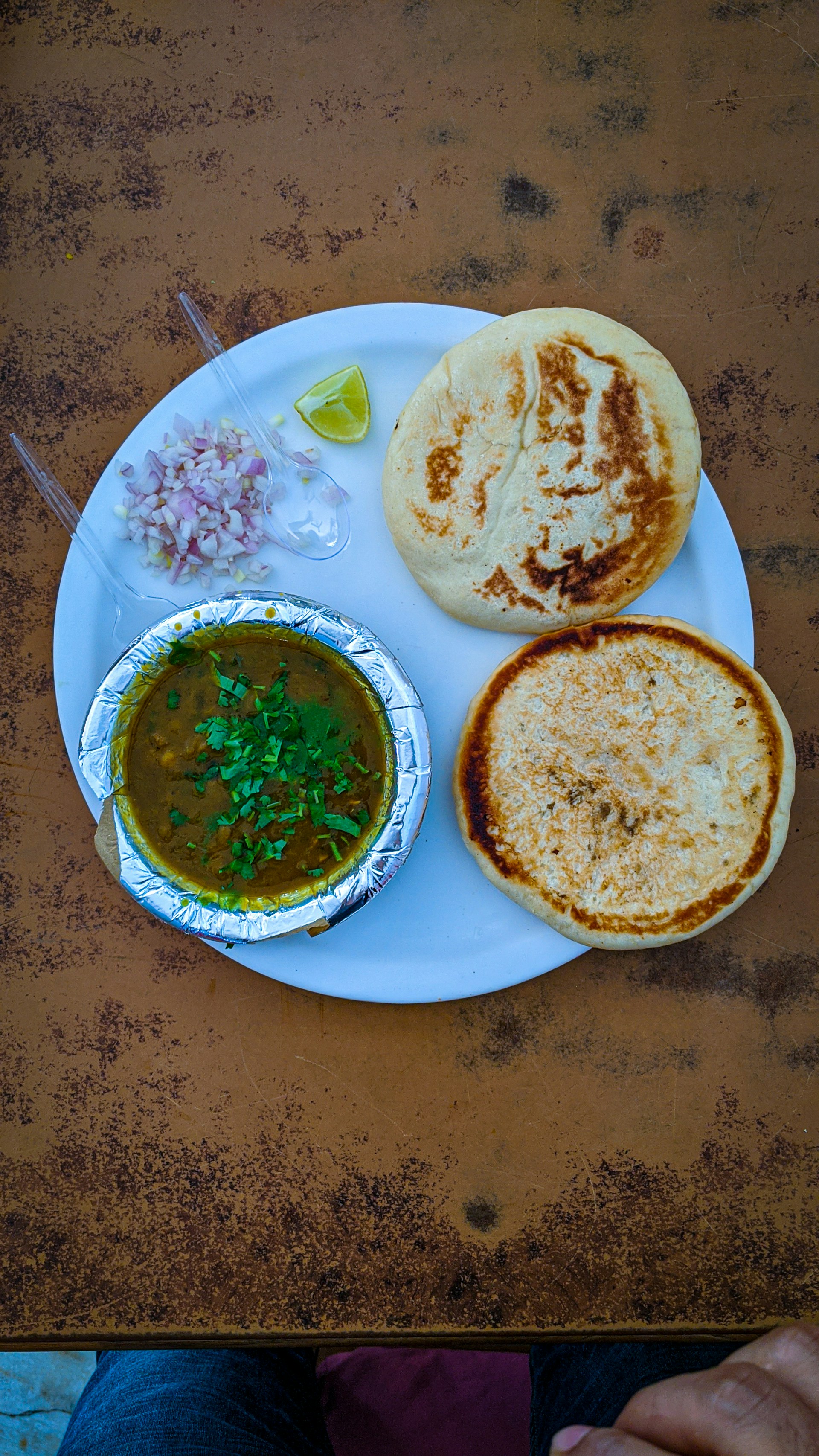 woman wearing yellow long-sleeved dress under white clouds and blue sky during daytime