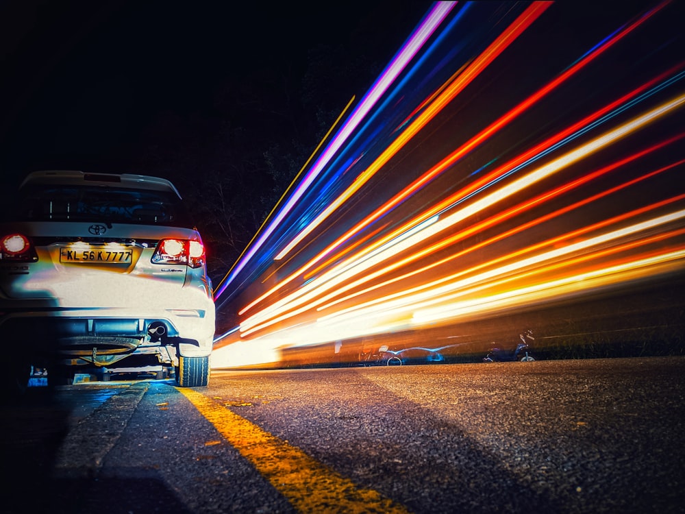 time lapse photography of vehicle on road