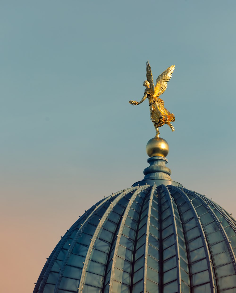 angle statue on roof