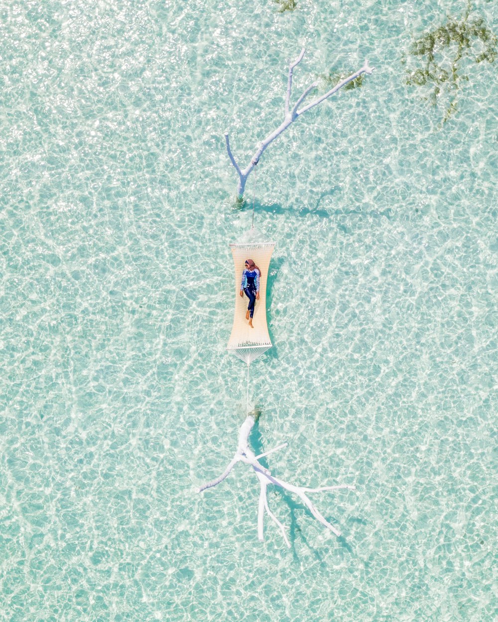 woman on hammock on sea