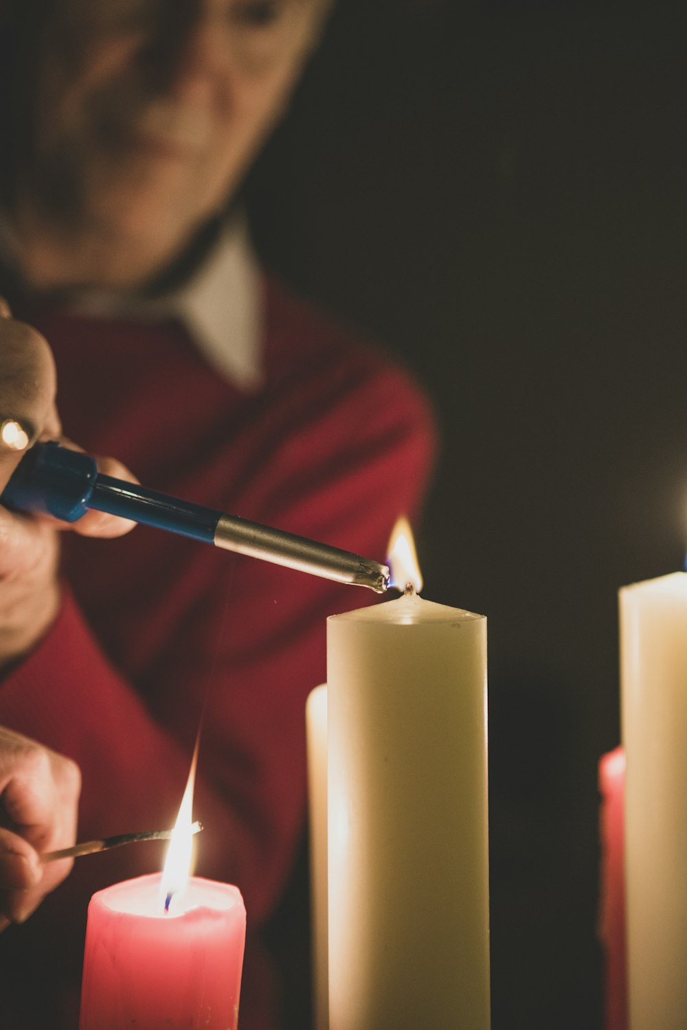 man lighting candles