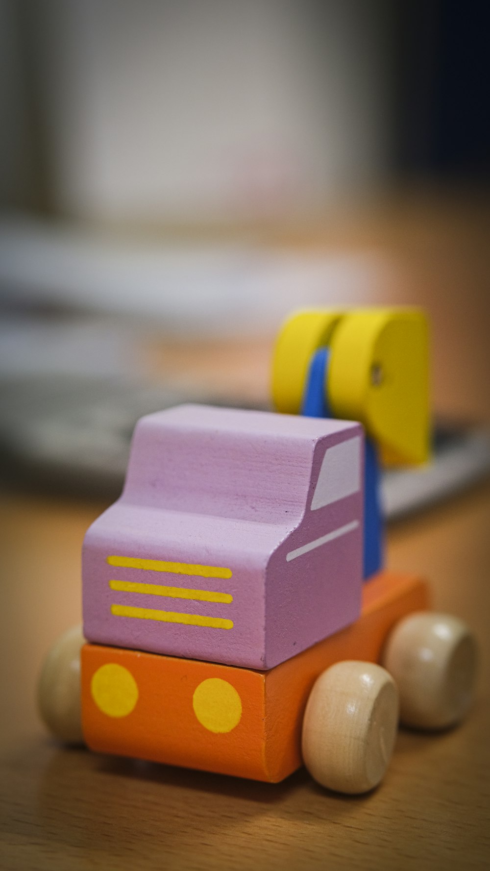 selective focus photography of orange and purple block car toy