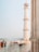 people walking near brown concrete tower painting