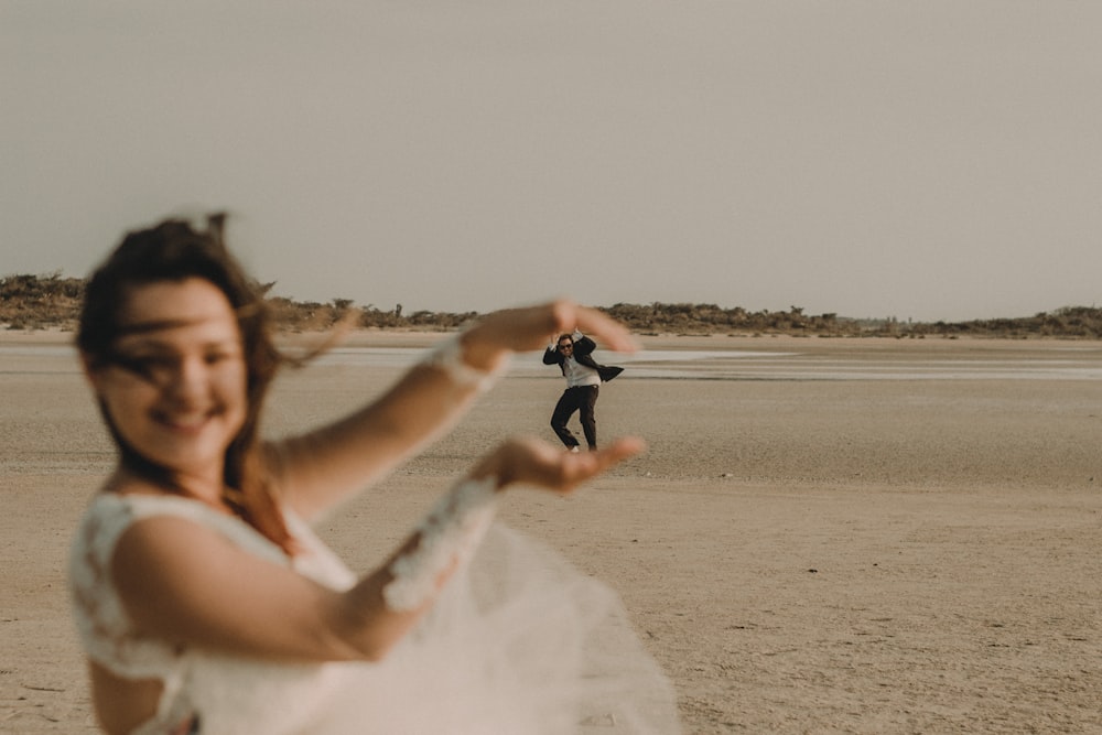 force perspective photography of woman crushing man with hands