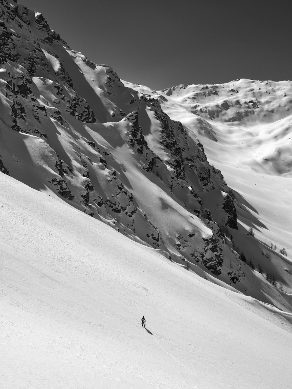 person on snow field mountain during day