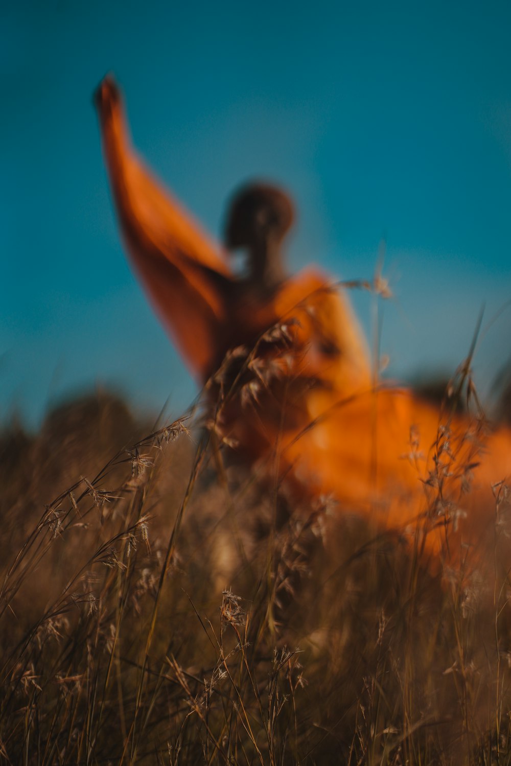 woman standing on grass field during day