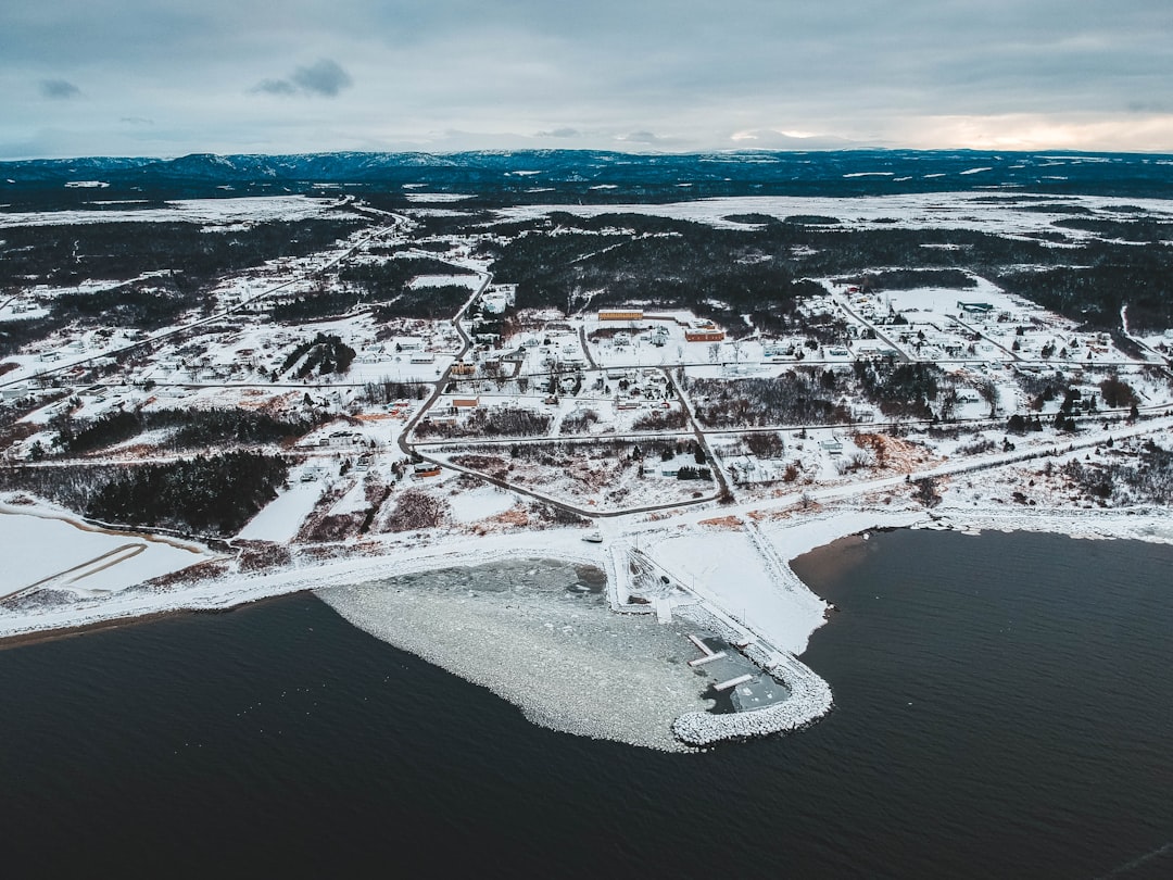 aerial photography of snowy ground near sea