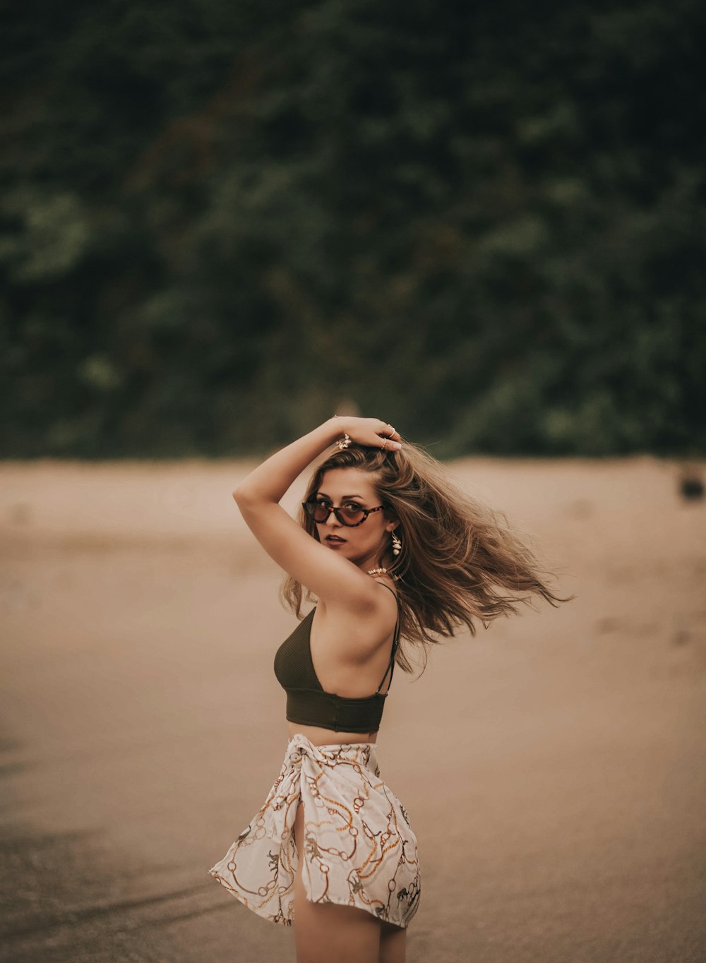 woman standing on shore in macro photography