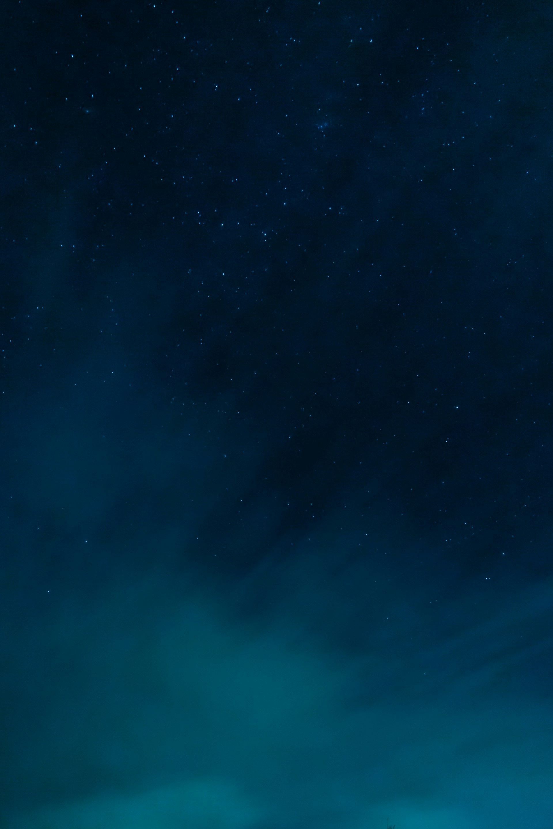 a night sky with stars and clouds