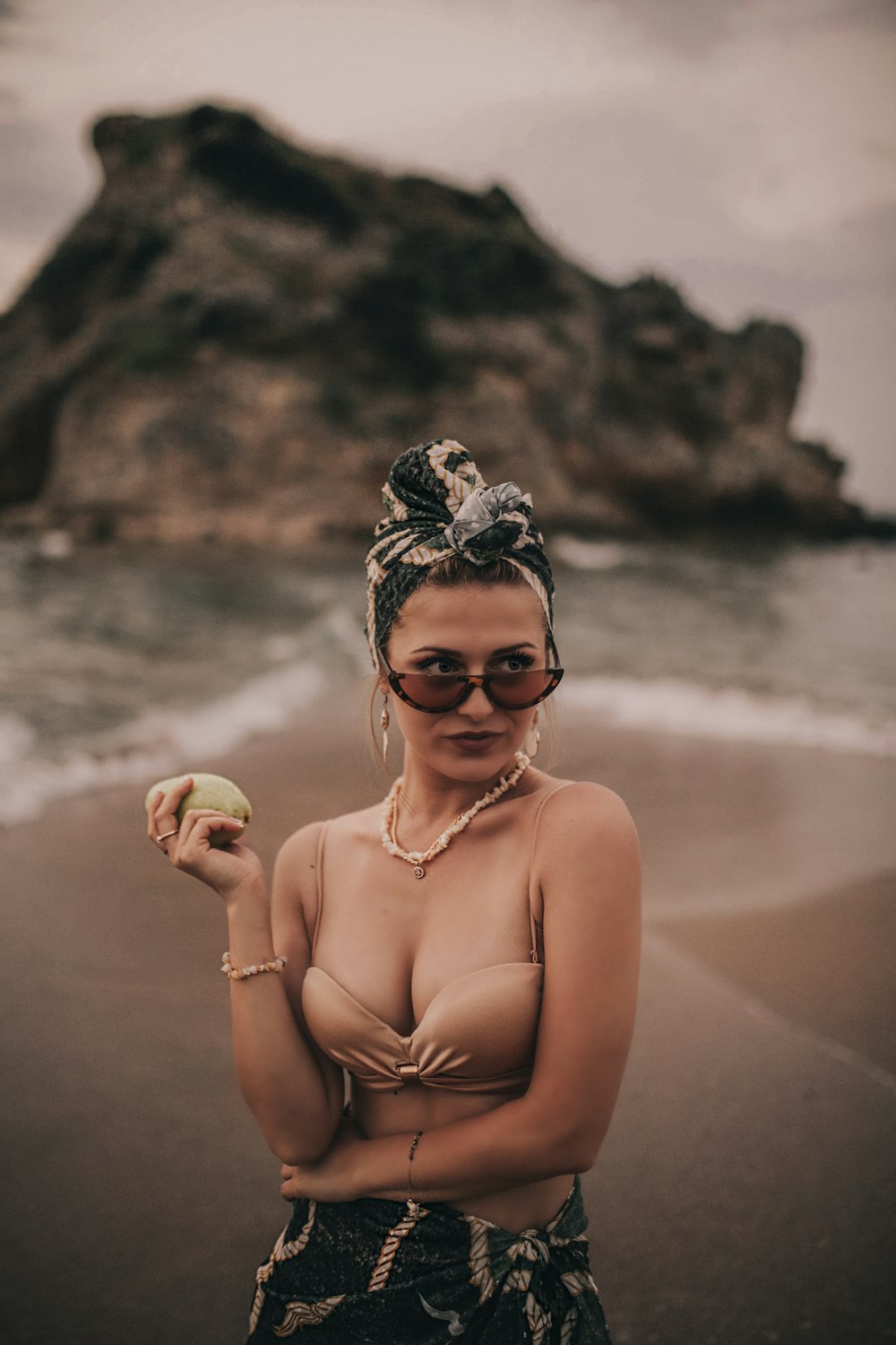 selective focus photography of woman standing on seashore