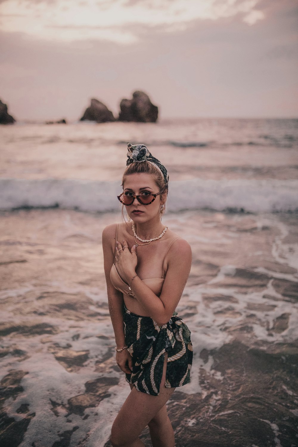 woman standing on the shoreline