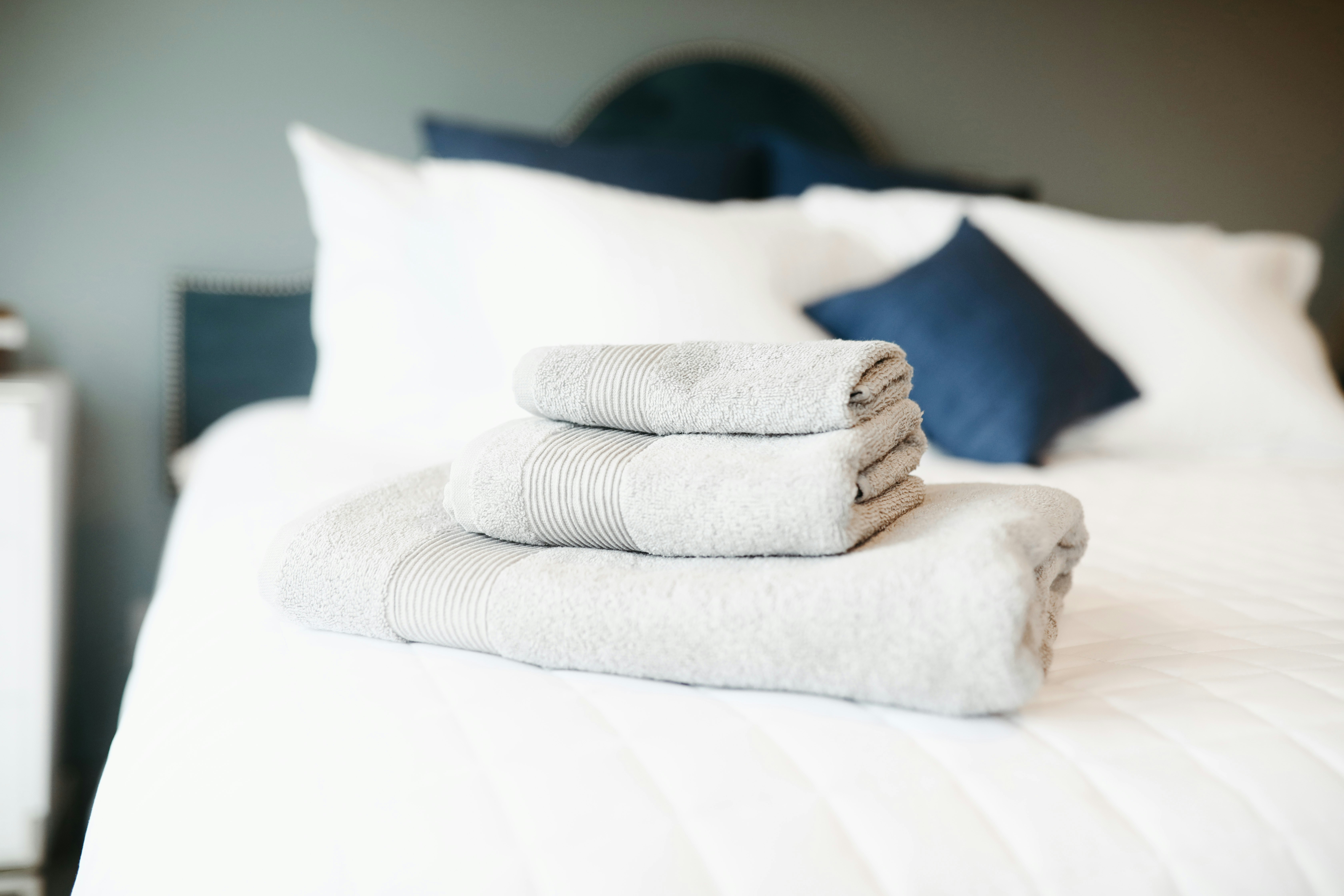 folded towels on bed