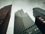a couple of tall buildings sitting next to each other