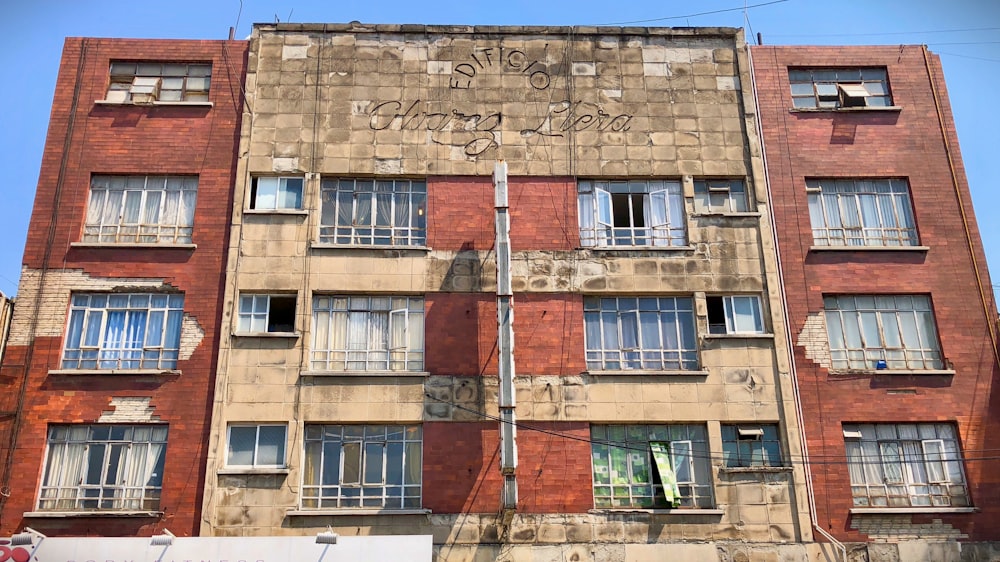 a tall brick building with lots of windows