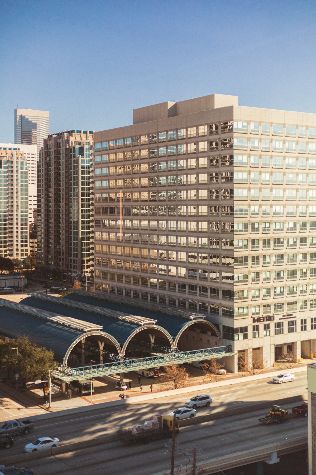 aerial photography of different vehicles on road viewing high-rise buildings during daytime