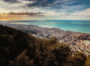 aerial photography of mountain and sea during daytime
