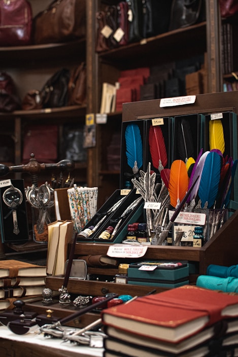 Close-up of premium branded stationery items including elegant pens and sleek notebooks with the Pondy Books logo subtly visible.