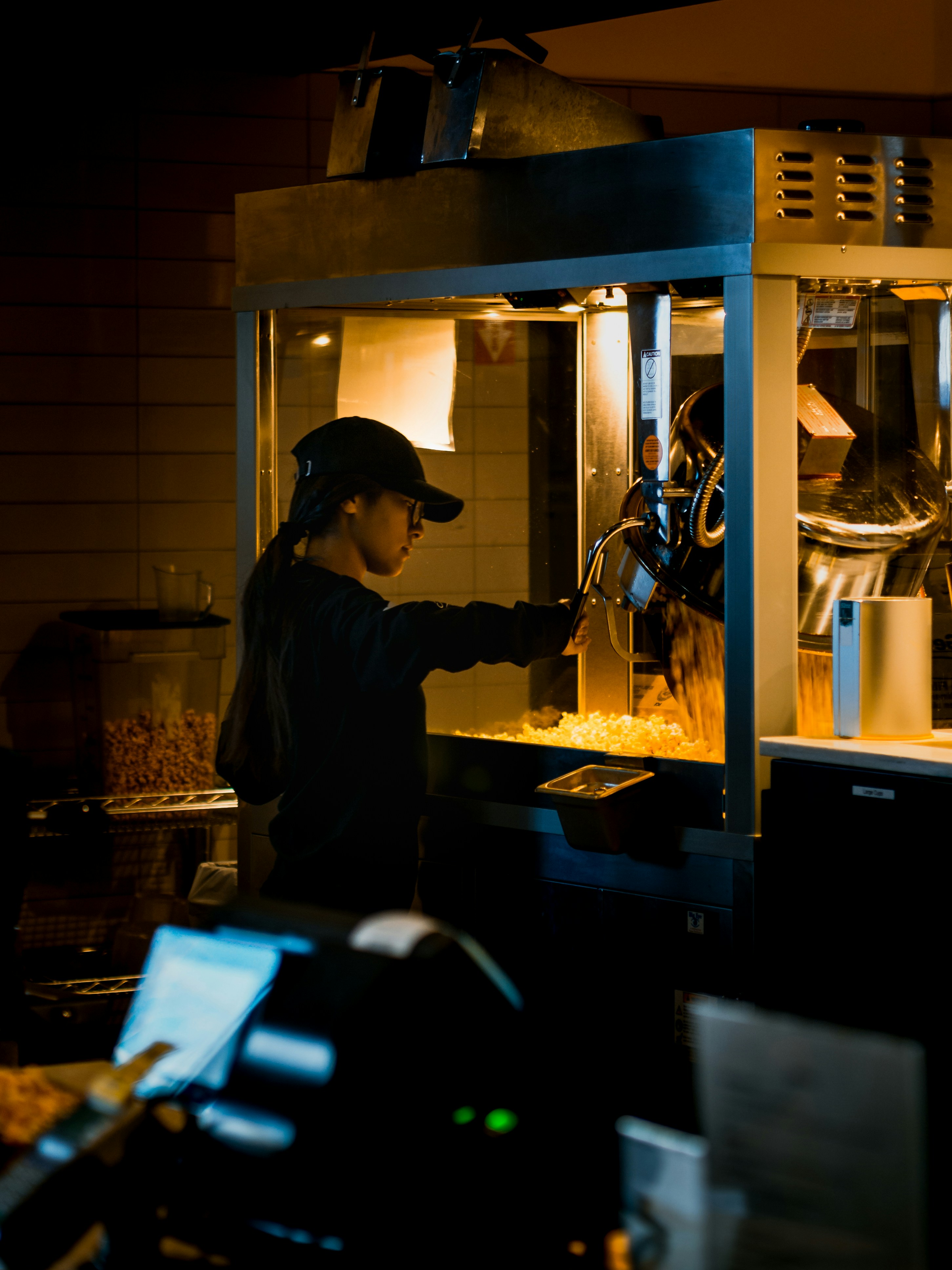 Woman Beside Popcorn Machine Photo Free Human Image On Unsplash