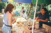 woman standing in front of stall