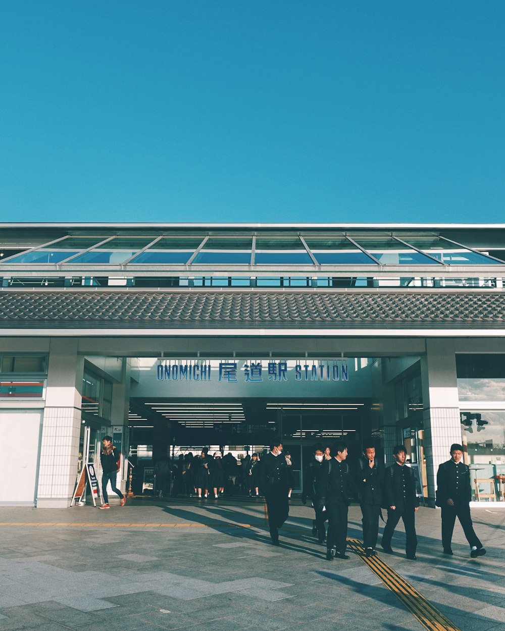 people near and in the terminal during day