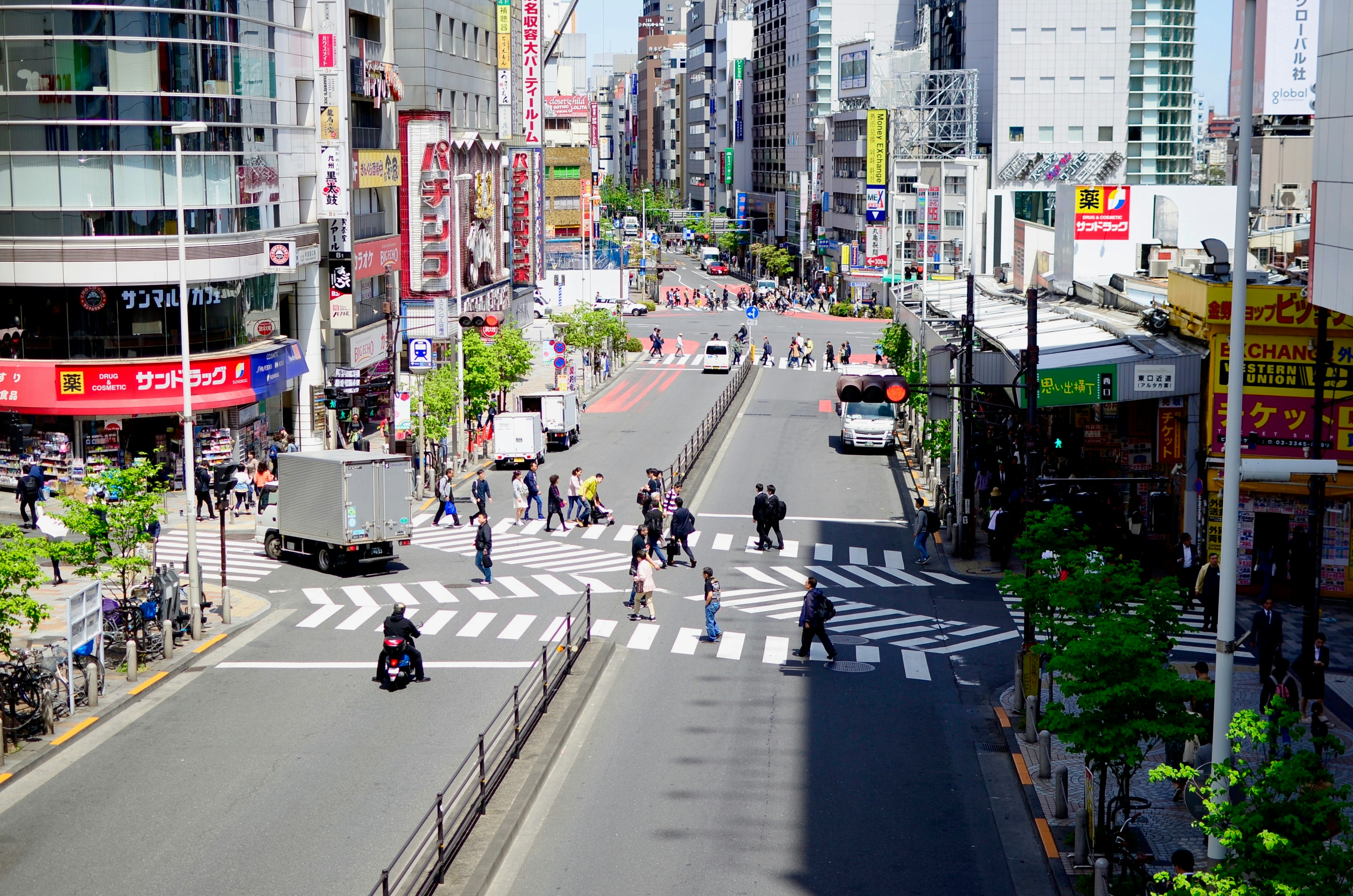 a city street filled with lots of tall buildings