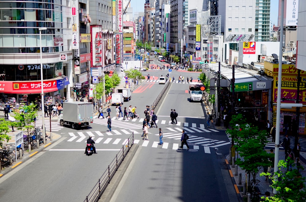 a city street filled with lots of tall buildings